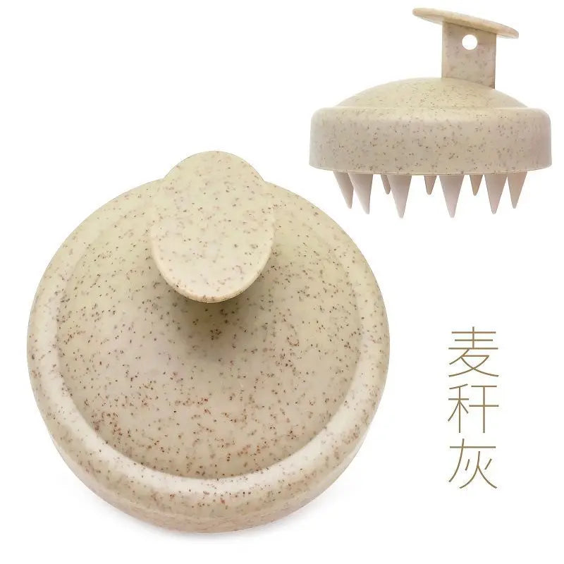 Silicone scalp massage brush comb in a yellow color, designed for head massages and hair care.