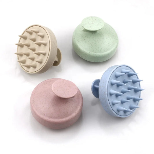 Silicone scalp massage brush combs in four colors: beige, green, pink, and blue, designed for head massage and relaxation.